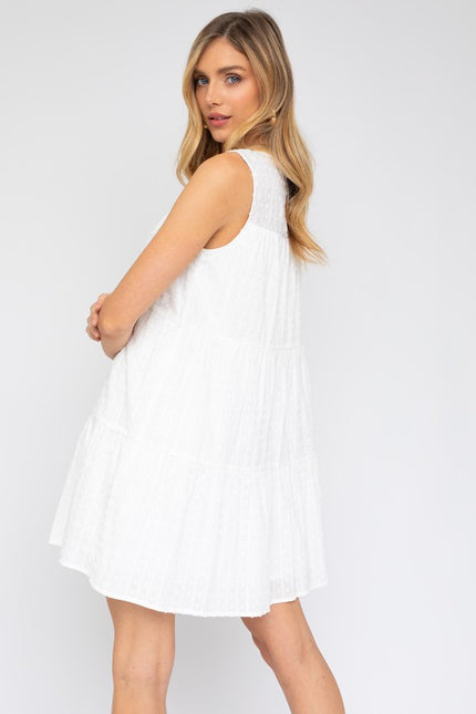 Boho-style sleeveless tiered mini dress for women, featuring flowy layers.