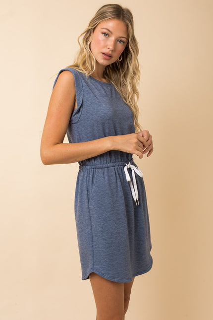 Side view of sleeveless drawstring mini pocket dress, highlighting relaxed fit and lightweight fabric.
