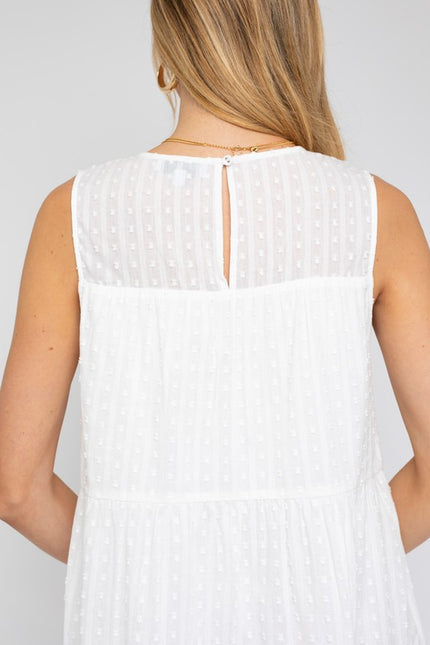 Sleeveless tiered mini dress with back button closure for easy wear.