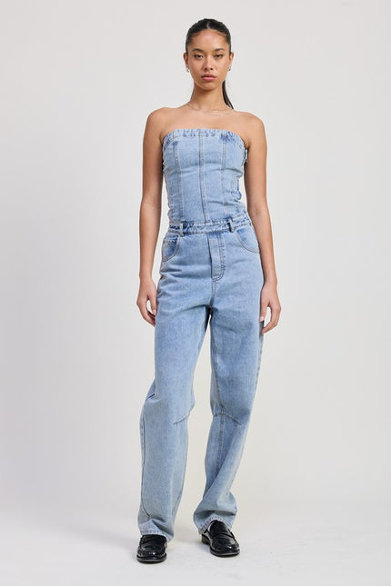 Light-wash strapless denim jumpsuit featuring a structured corset-style bodice, ruched top hem, and relaxed wide-leg fit.